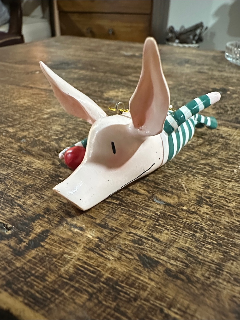 Kids Striped Pig Ornament - Pink & Green with a red ornament.